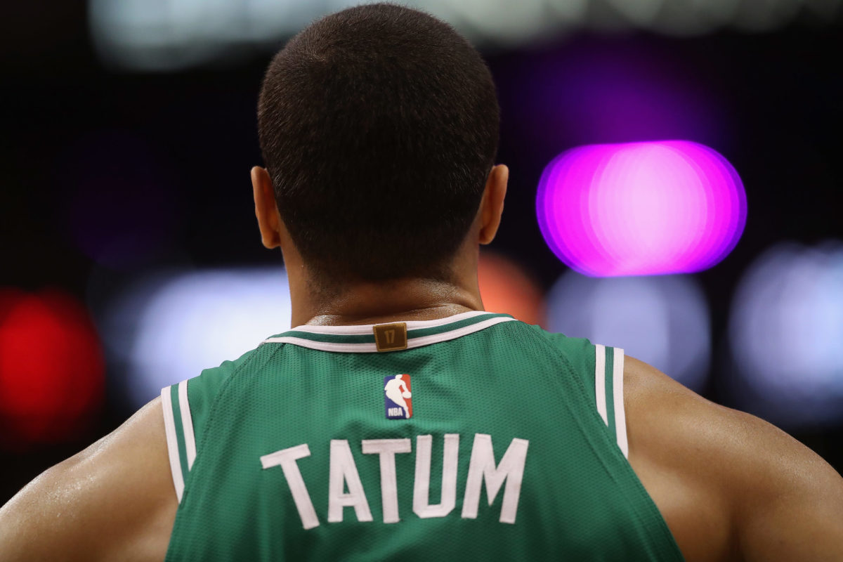 A photo of Jayson Tatum taken from behind.