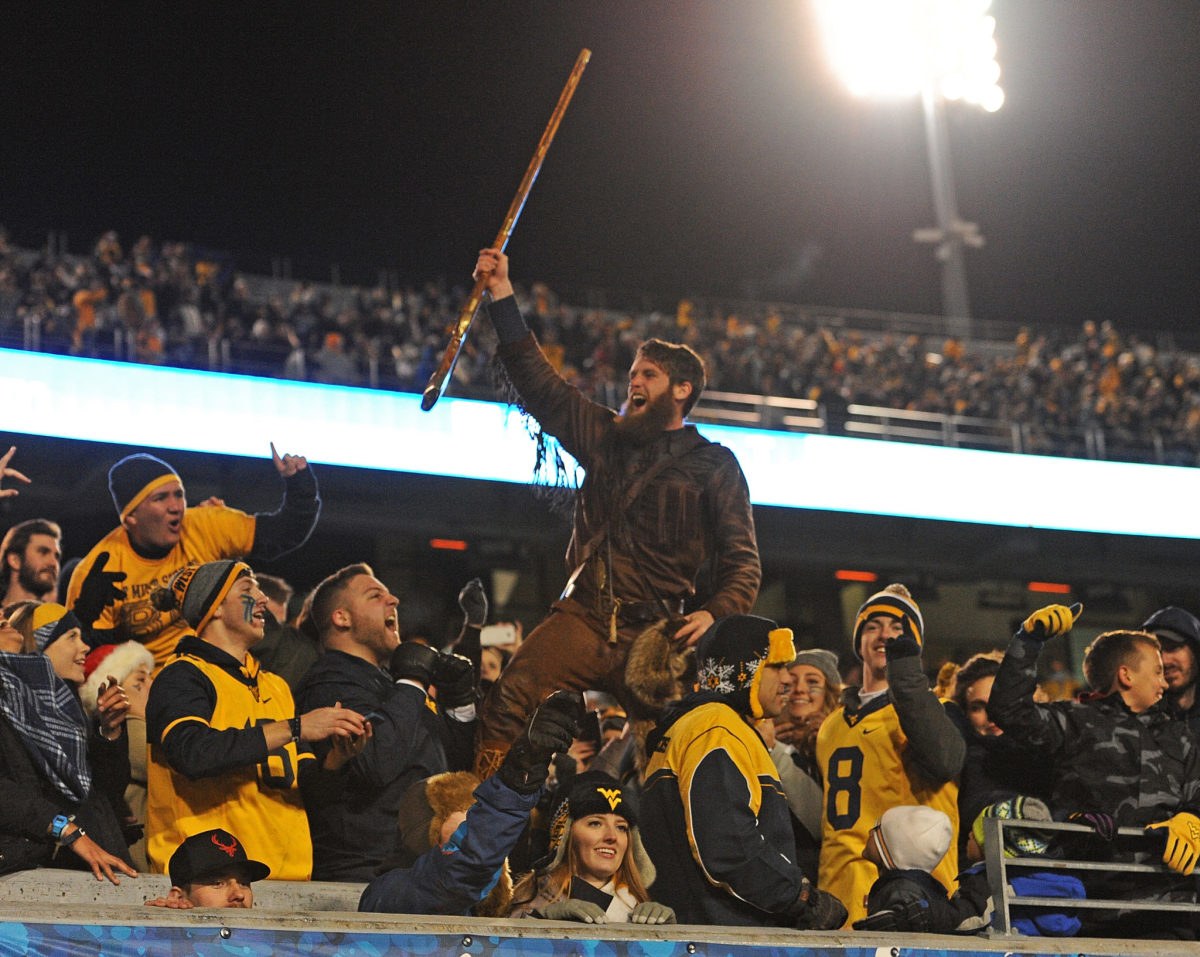 West Virginia's mascot celebrating with the crowd.