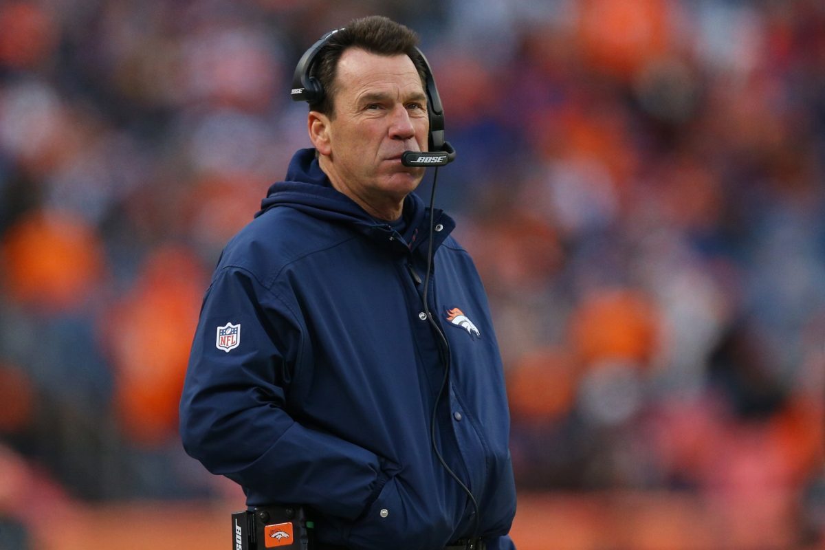 Gary Kubiak stands on the sideline.