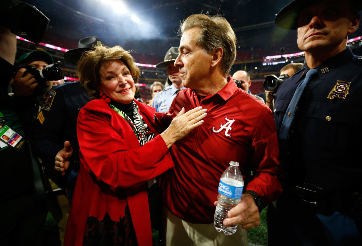 Head coach Nick Saban of the Alabama Crimson Tide celebrates with his wife Terry after beating the Georgia Bulldogs.