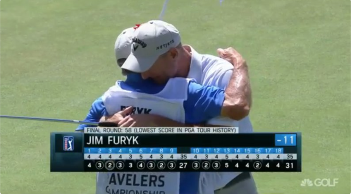 Jim Furyk hugging his caddie after breaking a PGA record