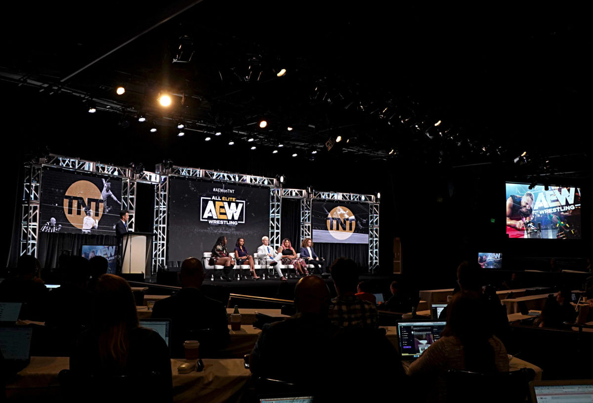 AEW TNT stage with wrestling stars.