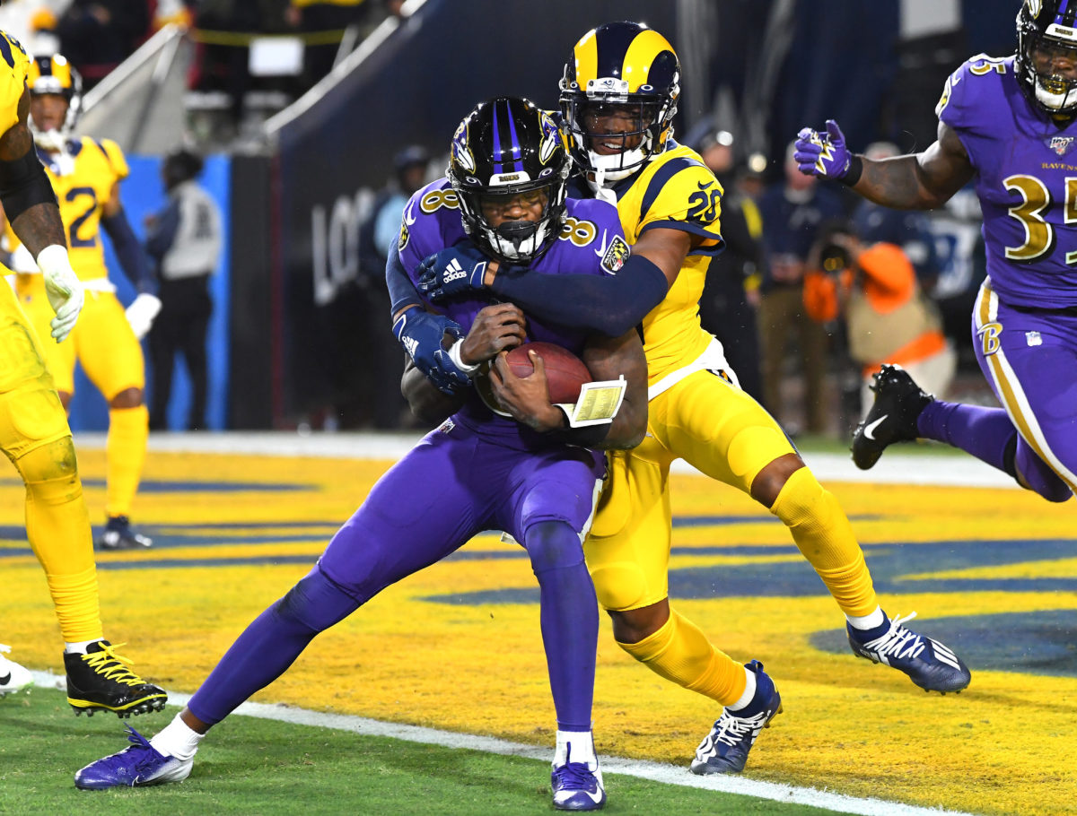 Los Angeles Rams cornerback Jalen Ramsey tackles Baltimore Ravens quarterback Lamar Jackson at one-yard line.