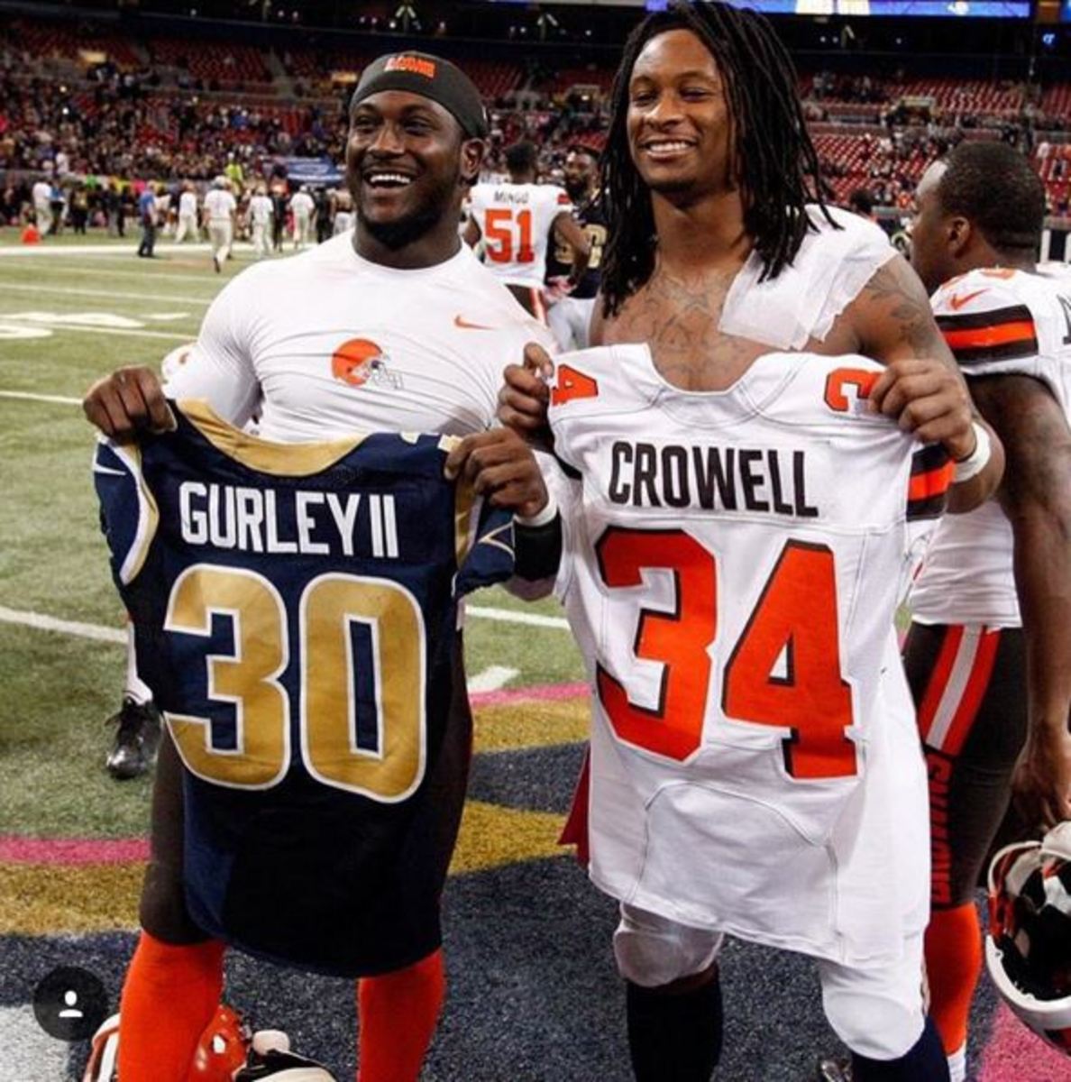 Todd Gurley and Isiah Crowell do a jersey swap.