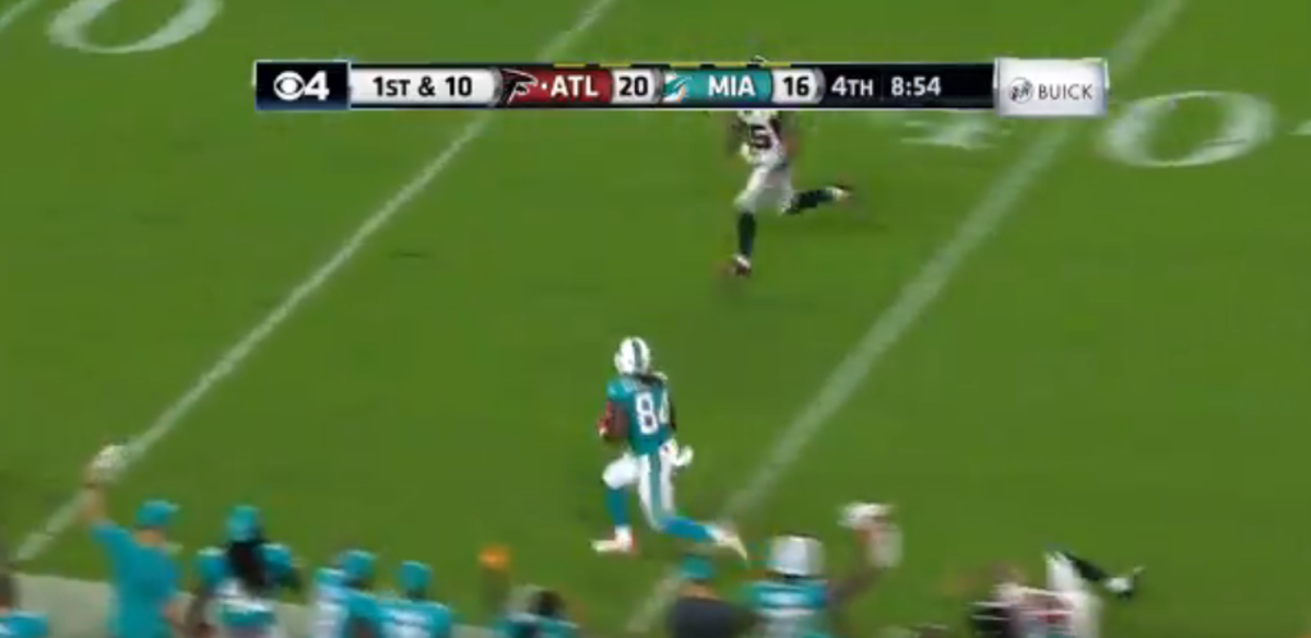 A Dolphins player catches a touchdown.