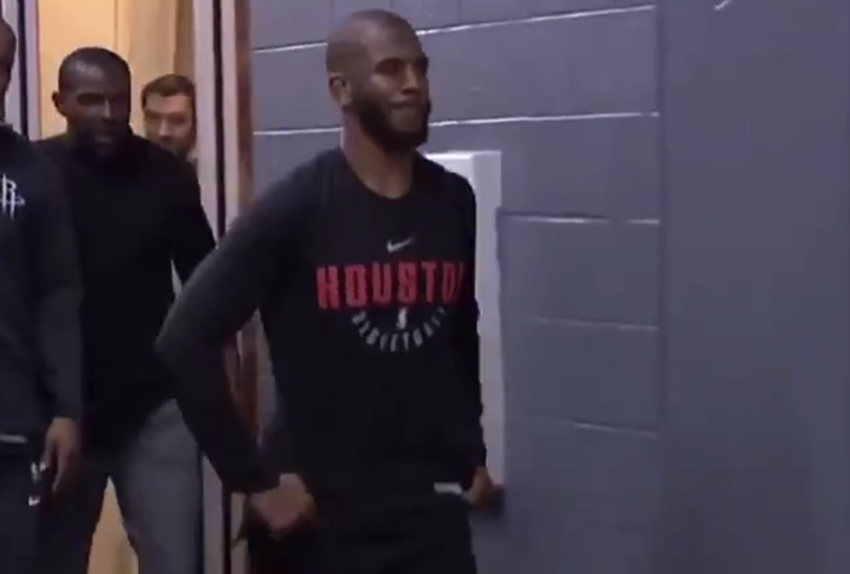 Chris Paul walking in the tunnel wearing a Houston Rockets warmup.
