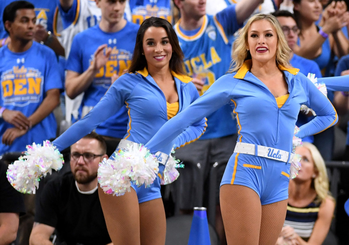 UCLA Bruins cheerleaders perform during a semifinal game of the Pac-12 basketball tournament against the Arizona Wildcats.