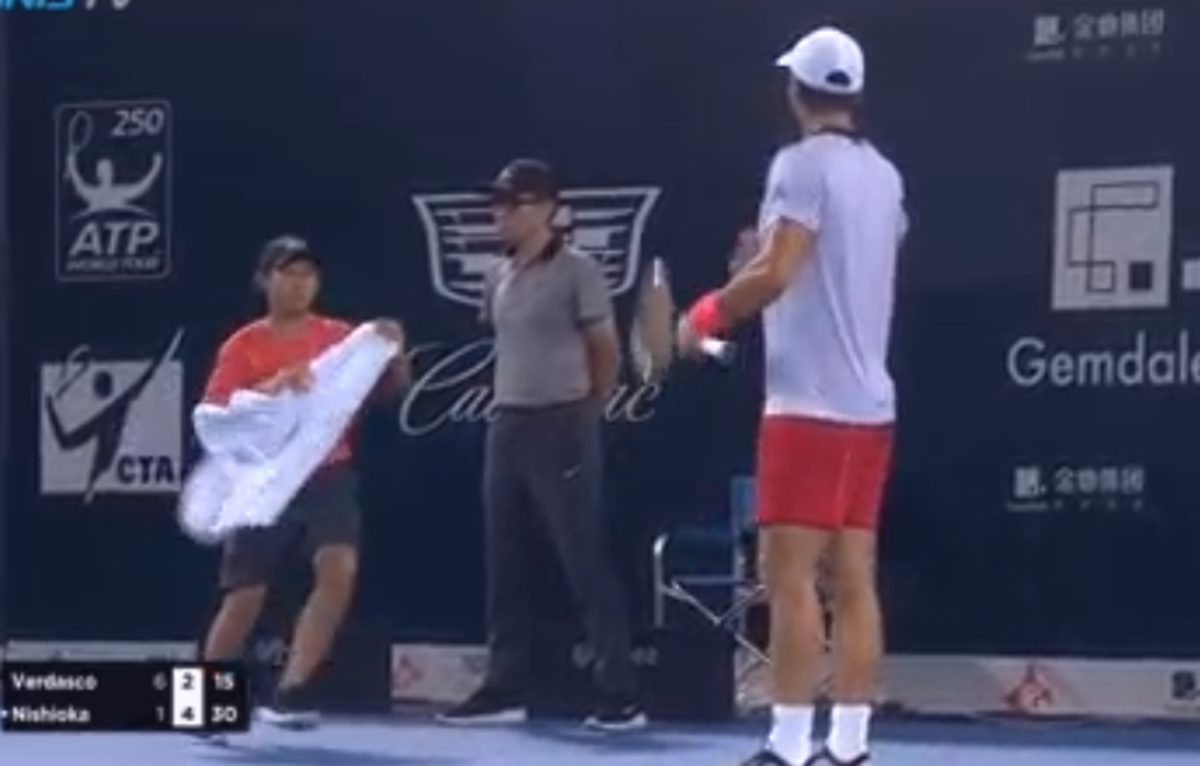 Fernando Verdasco berates a towel boy.