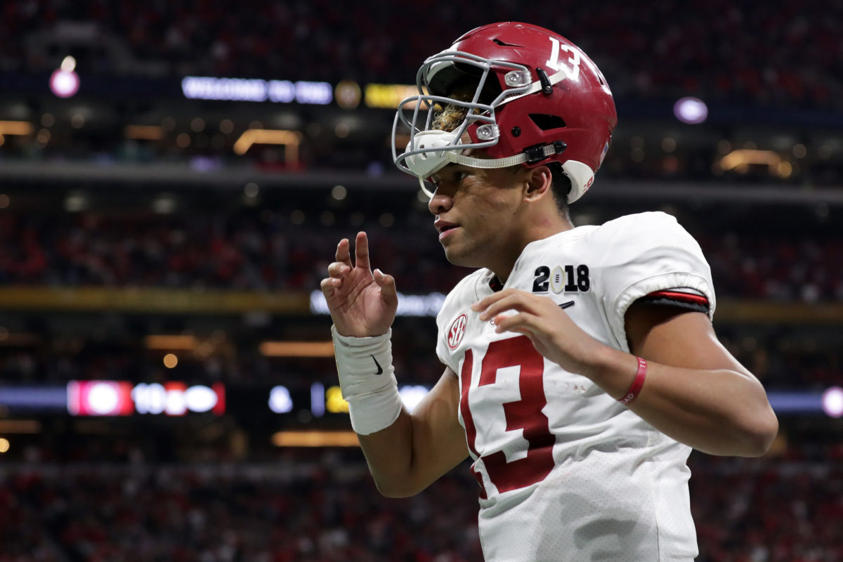 Tua Tagovailoa of the Alabama Crimson Tide reacts to throwing a seven yard touchdown pass during the fourth quarter against the Georgia Bulldogs.