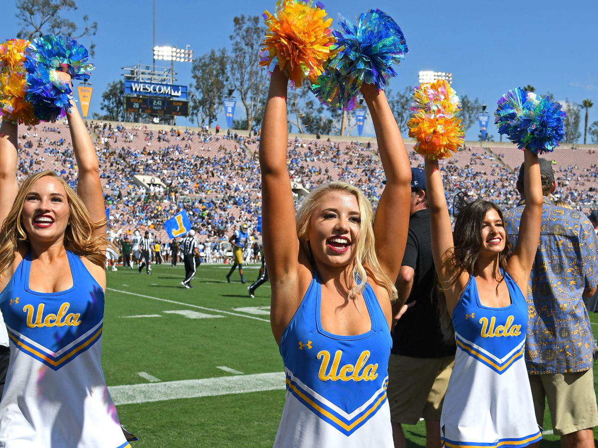 UCLA Bruins cheerleaders entertain the crowd during the game against the Hawaii Warriors at the Rose Bowl.