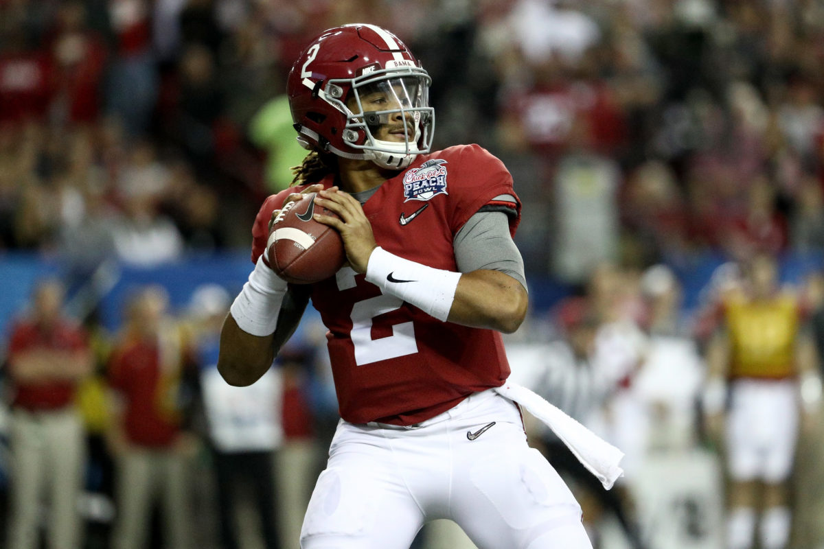 Jalen Hurts of the Alabama Crimson Tide passes the ball against the Washington Huskies during the 2016 Chick-fil-A Peach Bowl at the Georgia Dome.