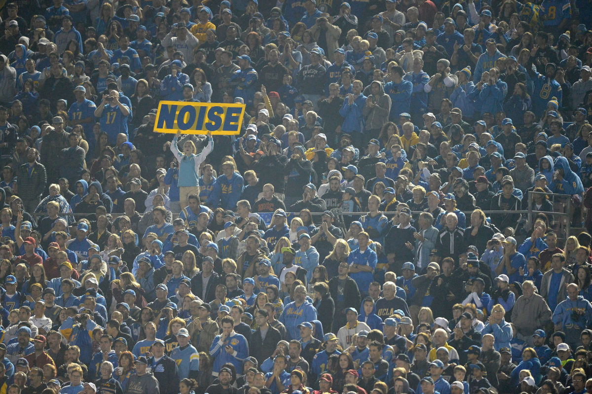 A UCLA Bruins fan holds up a noise sign during a 38-14 win over the USC Trojans at the Rose Bowl.