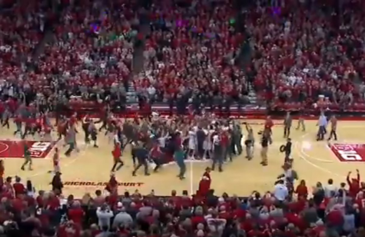 Wisconsin fans storm the court.