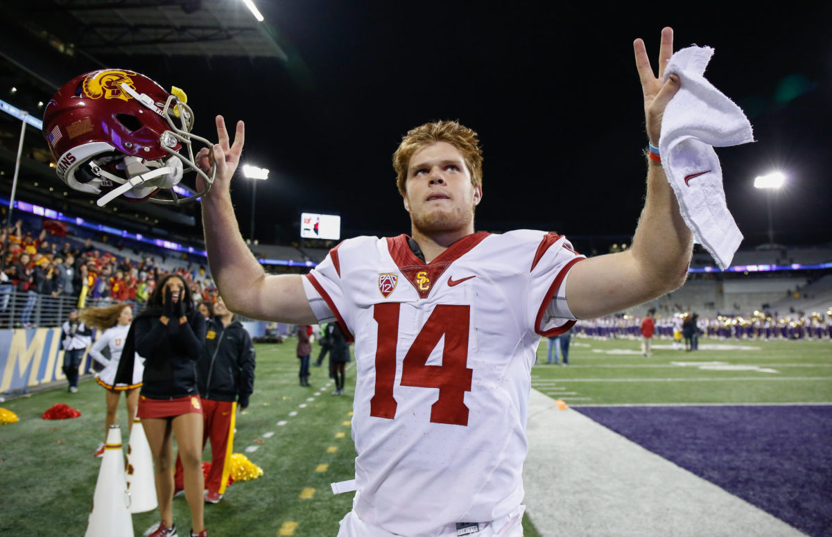 Sam Darnold throws up peace signs after a USC win.