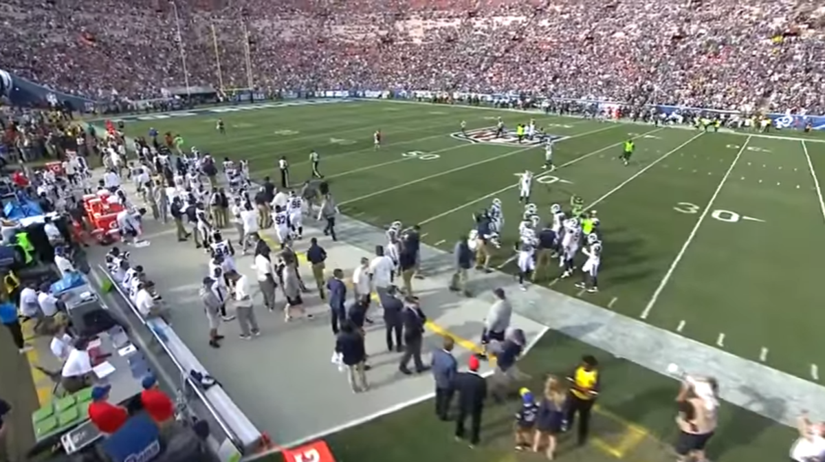 Los Angeles Rams prepare to kick off against the Philadelphia Eagles at the Coliseum.