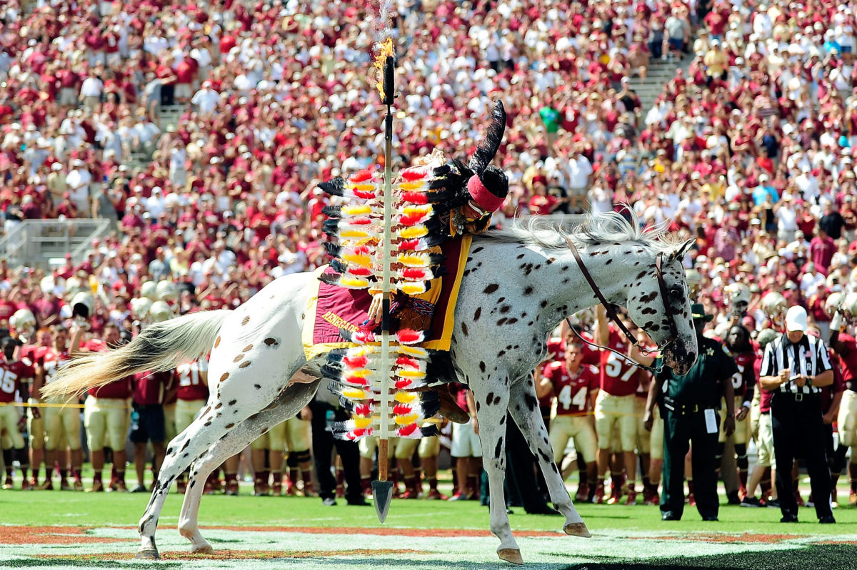 Florida State's mascot running on the field before a game.
