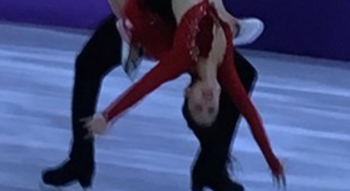 A figure skater experiencing a wardrobe malfunction.