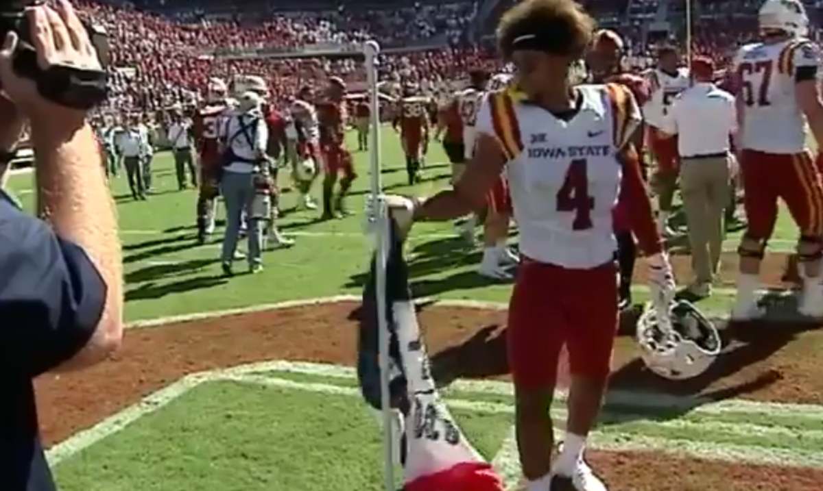 Iowa State plants flag at Oklahoma after win.