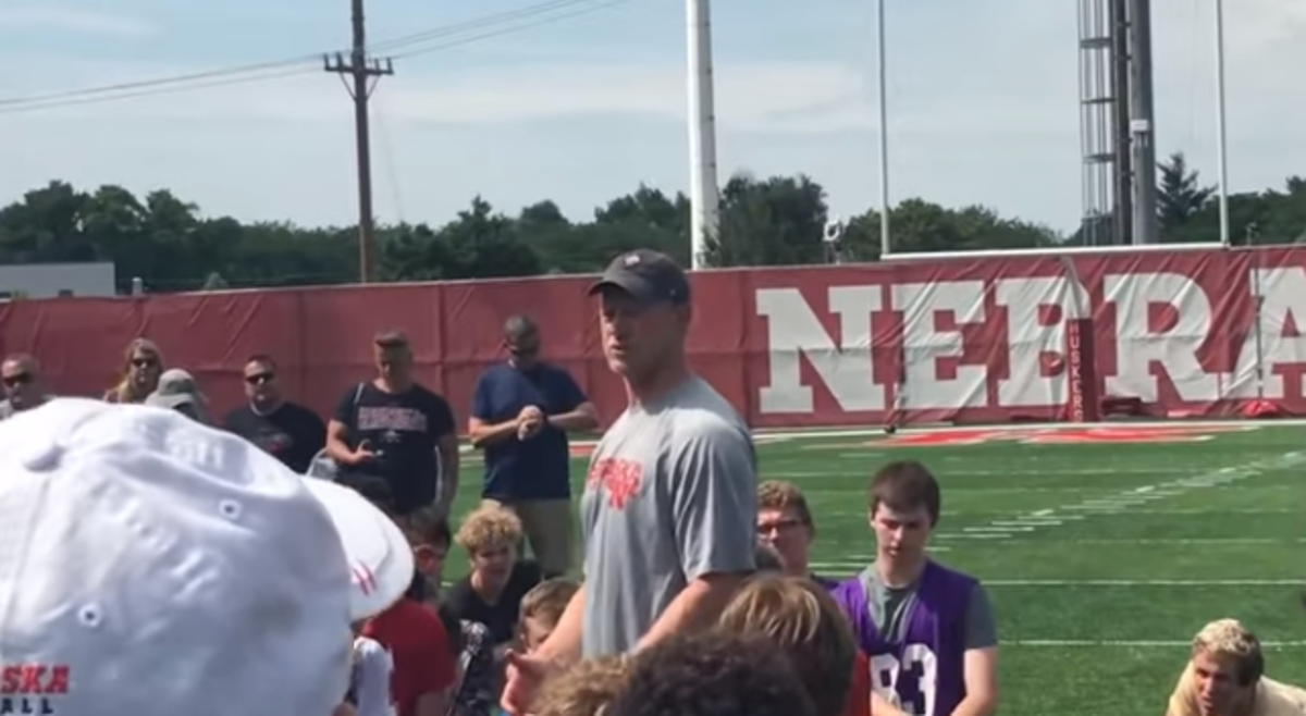 Scott Frost speaks to players at a Nebraska football camp.