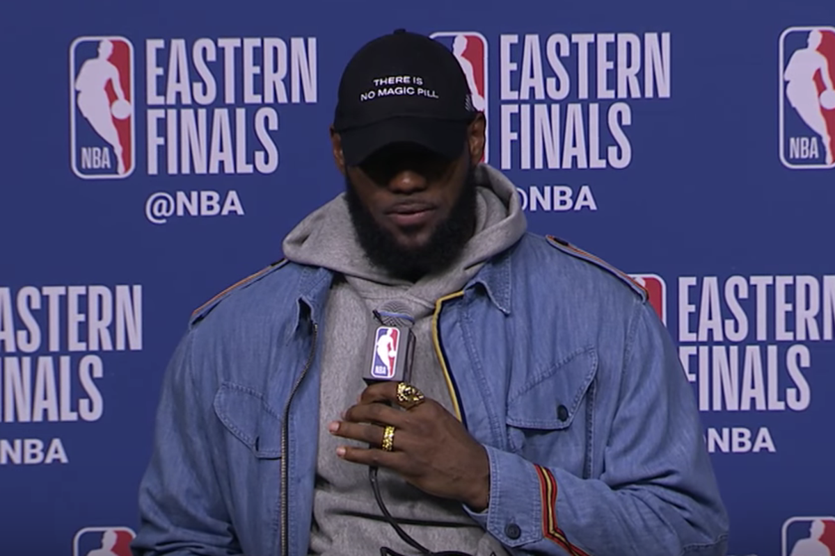 LeBron James holding a microphone during an interview.