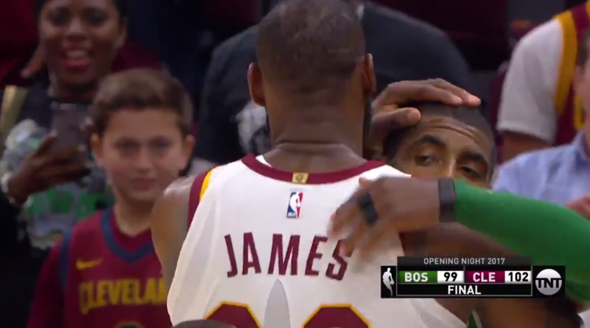 Kyrie Irving and LeBron James embrace after game.