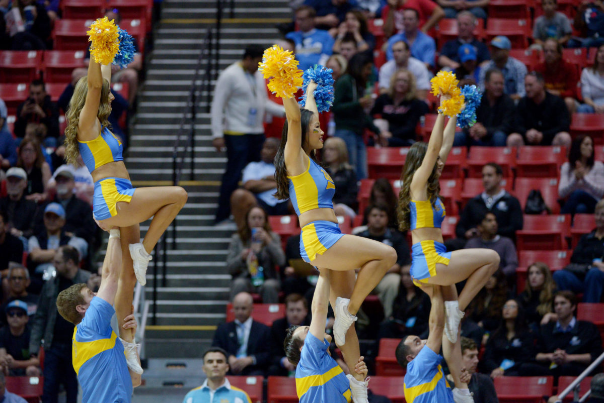 UCLA Bruins cheerleaders perform in the first half against the Stephen F. Austin Lumberjacks during the third round of the 2014 NCAA Men's Basketball Tournament.