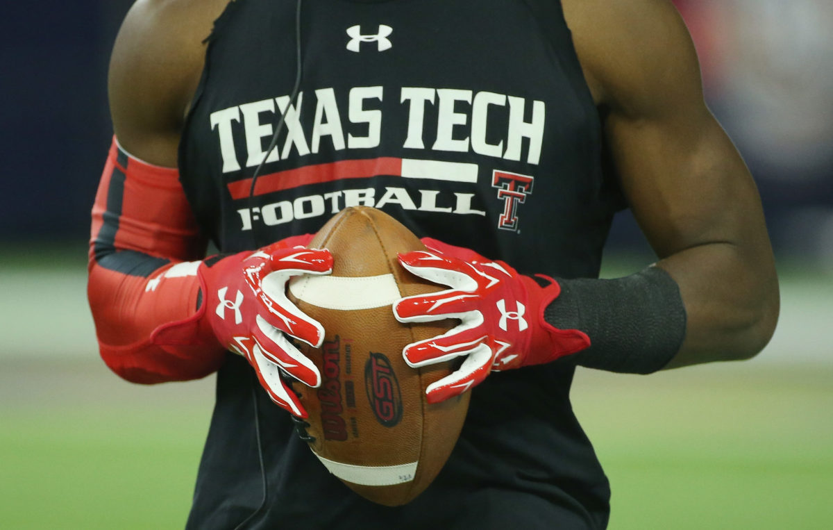 A photo of a Texas Tech football player from the neck down.