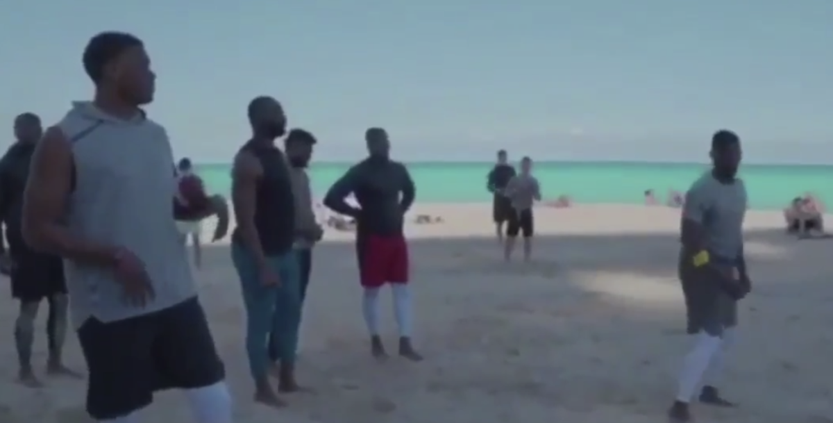 Dwayne Haskins works out on the beach.