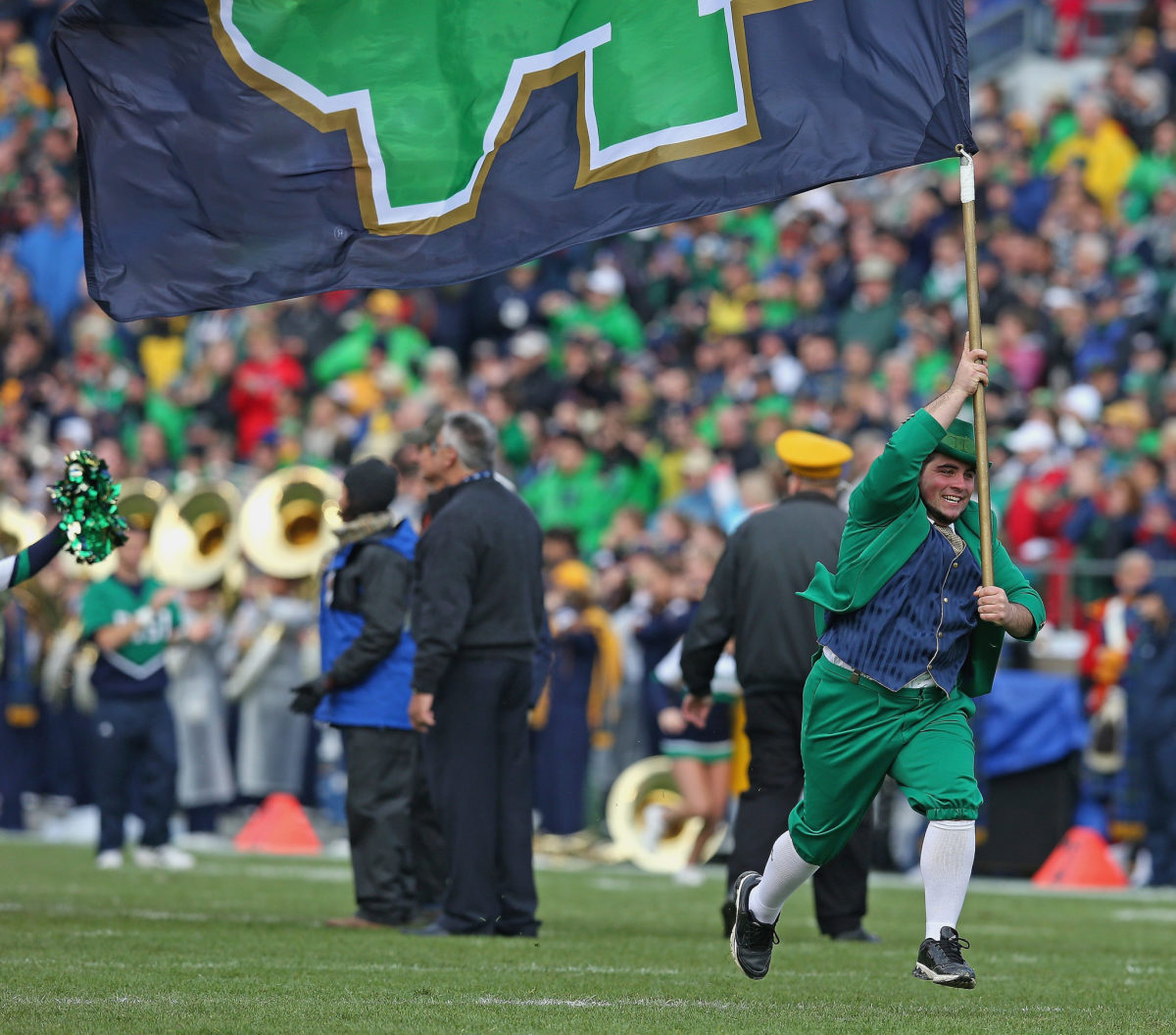Notre Dame's mascot running onto the field.