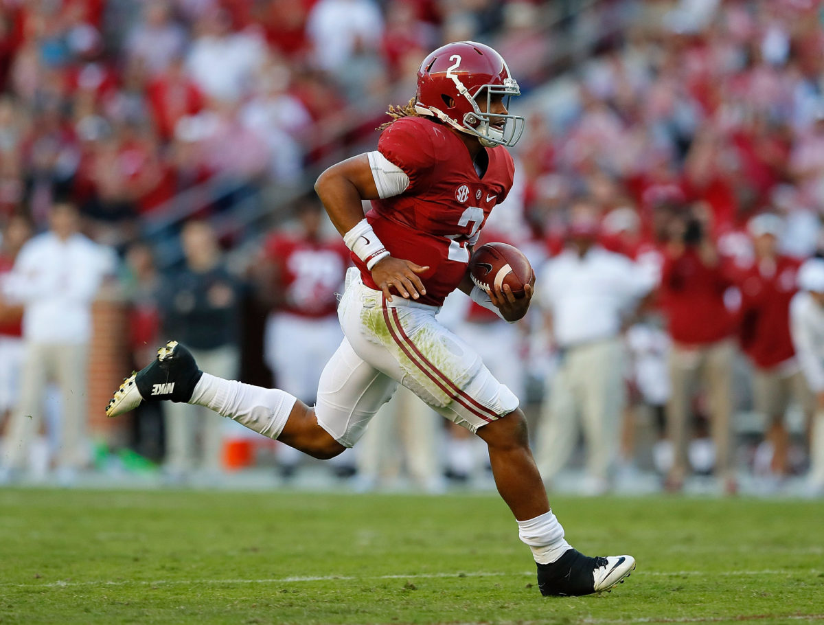 Jalen Hurts of the Alabama Crimson Tide rushes for a touchdown against the Texas A&amp;M Aggies at Bryant-Denny Stadium.