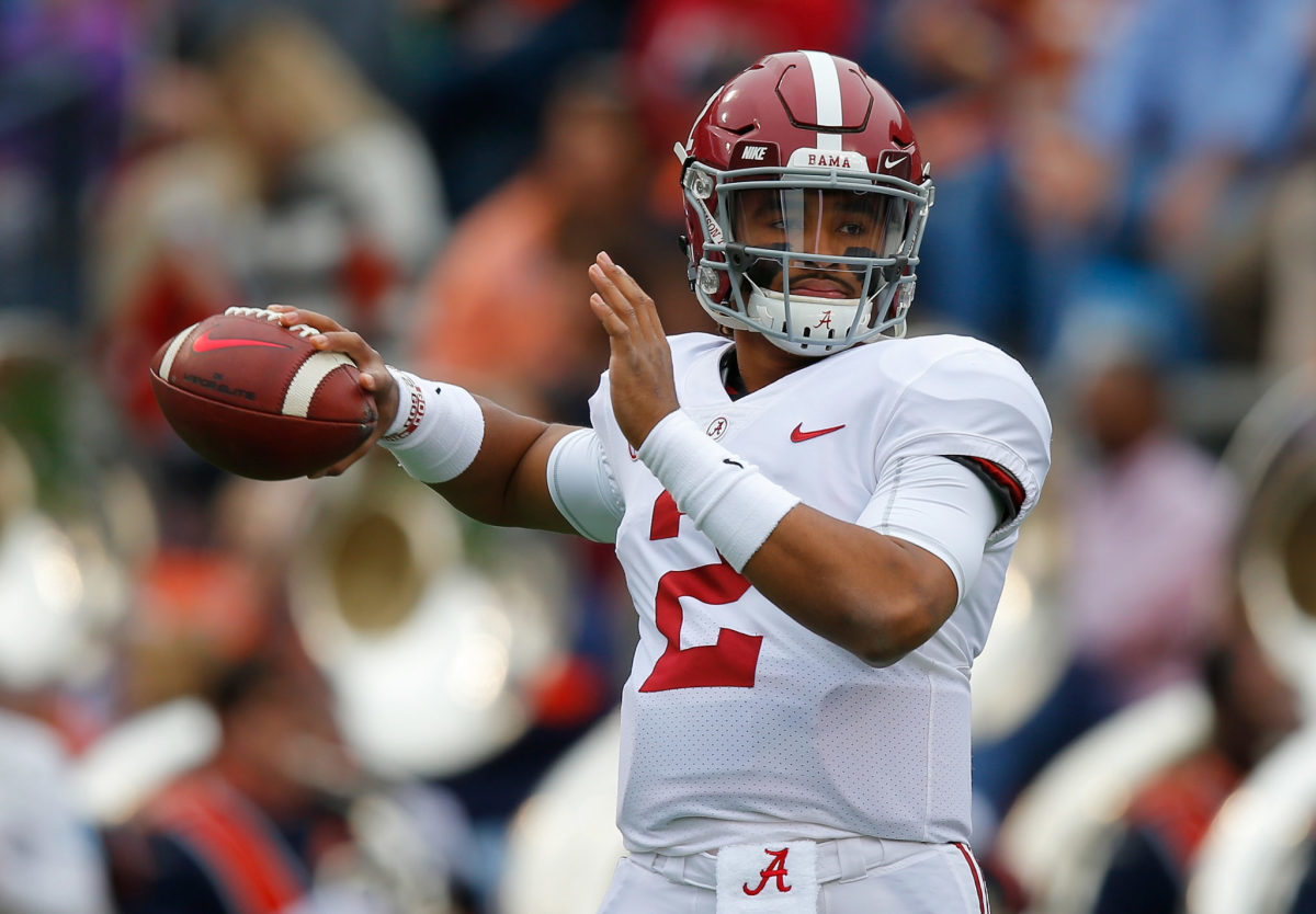 Jalen Hurts of the Alabama Crimson Tide warms up on the field prior to the game against the Auburn Tigers at Jordan Hare Stadium.