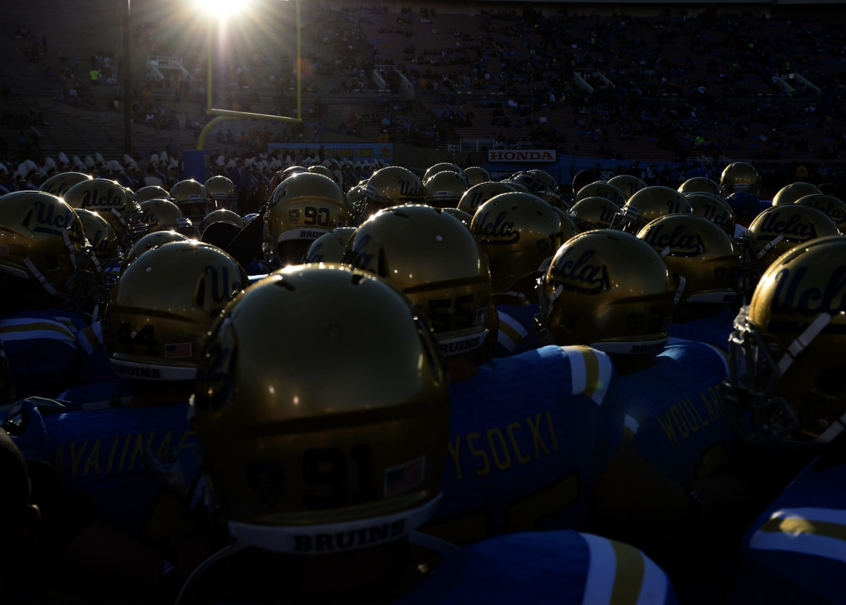 The UCLA Bruins huddle before the game against the Arizona State Sun Devils at Rose Bowl.