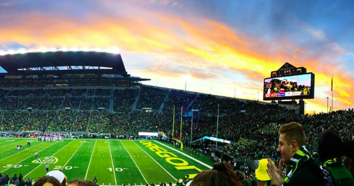 Oregon's Autzen Stadium with a beautiful sunset in the background