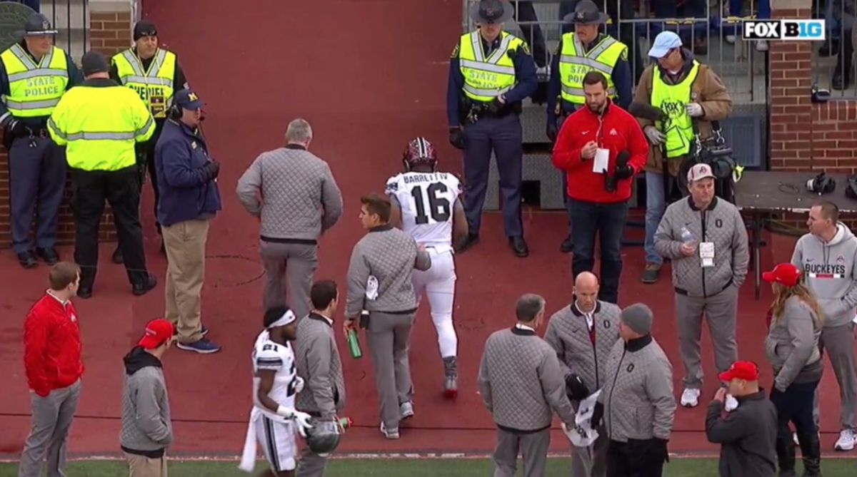 J.T. Barrett leaves game at Michigan with injury.