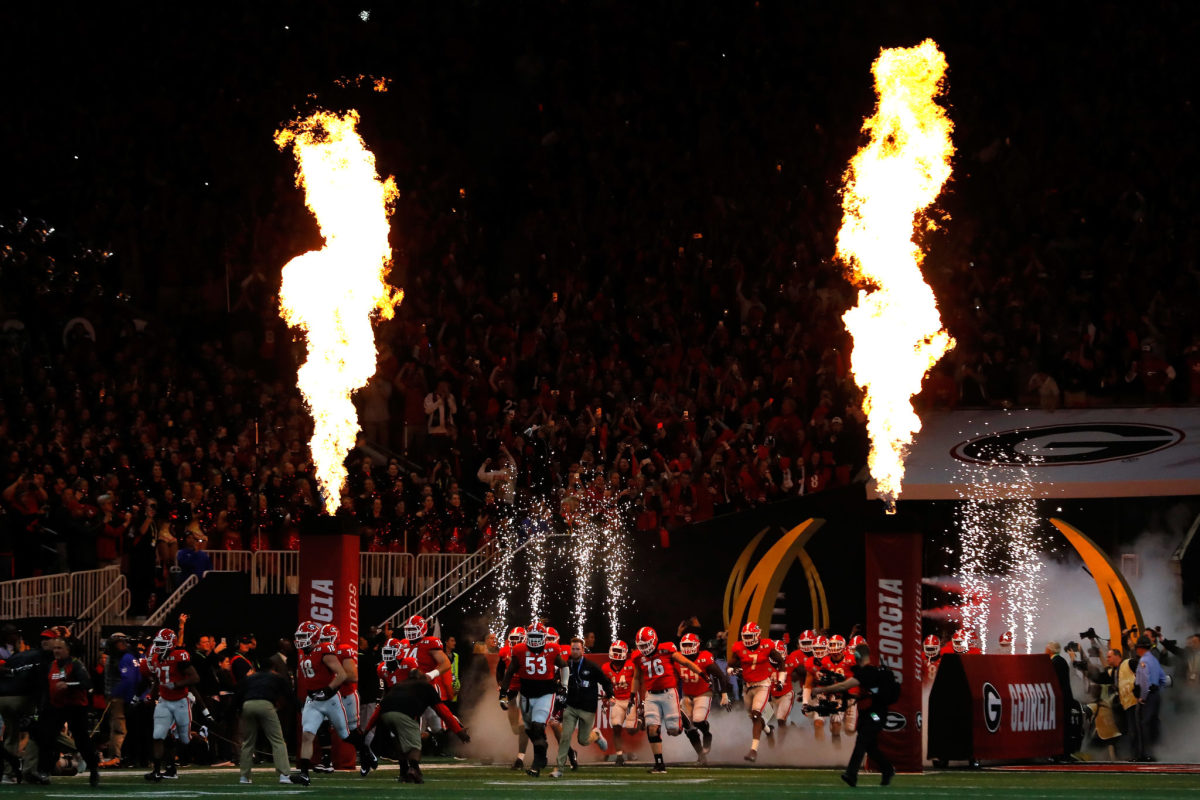 Georgia Bulldogs running onto the field at the National Championship game.