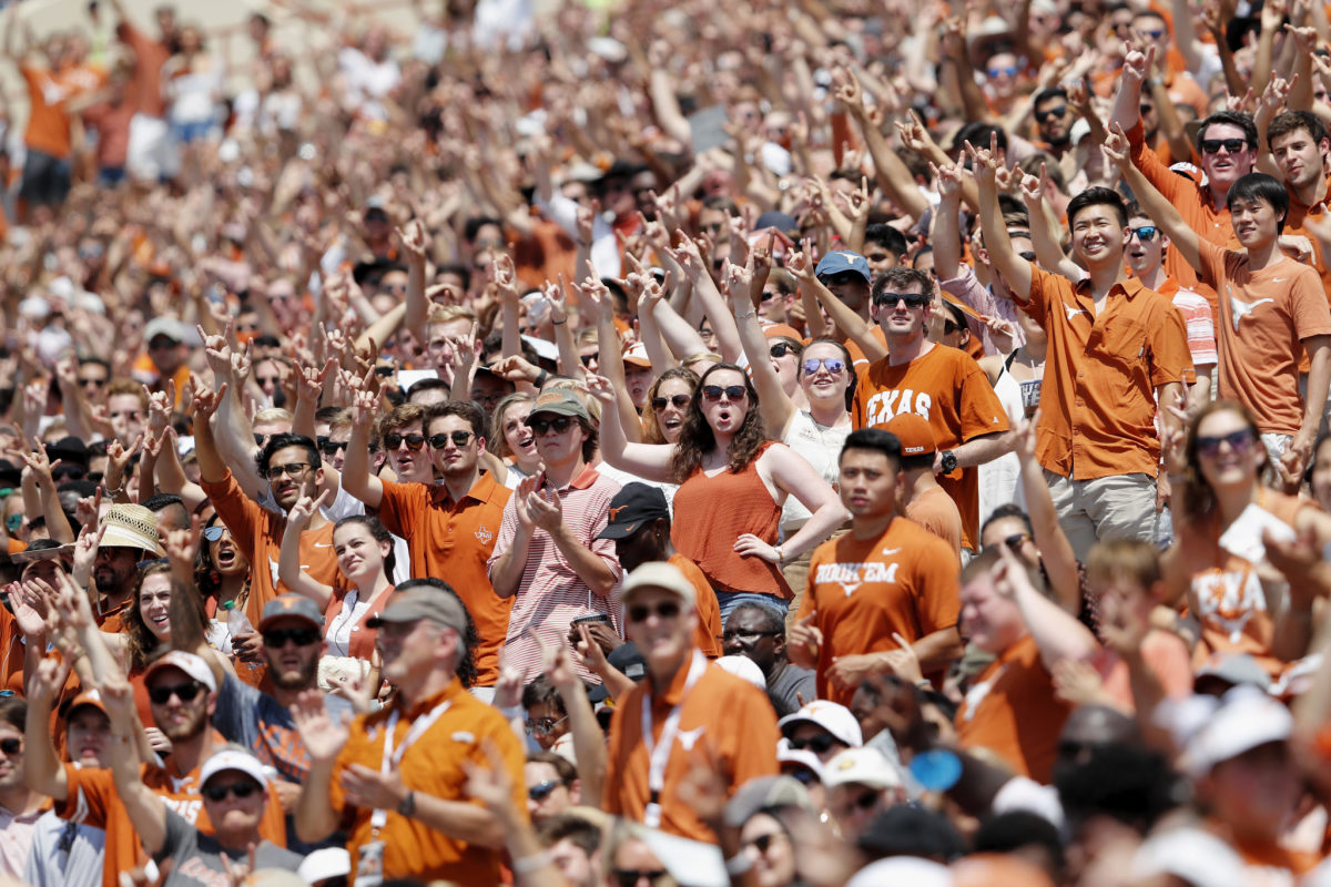 Texas Longhorns fans cheering during a game.