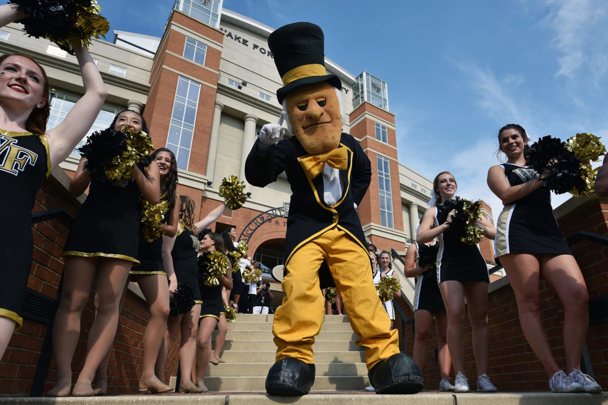 Wake Forest's mascot with the team's cheerleaders.
