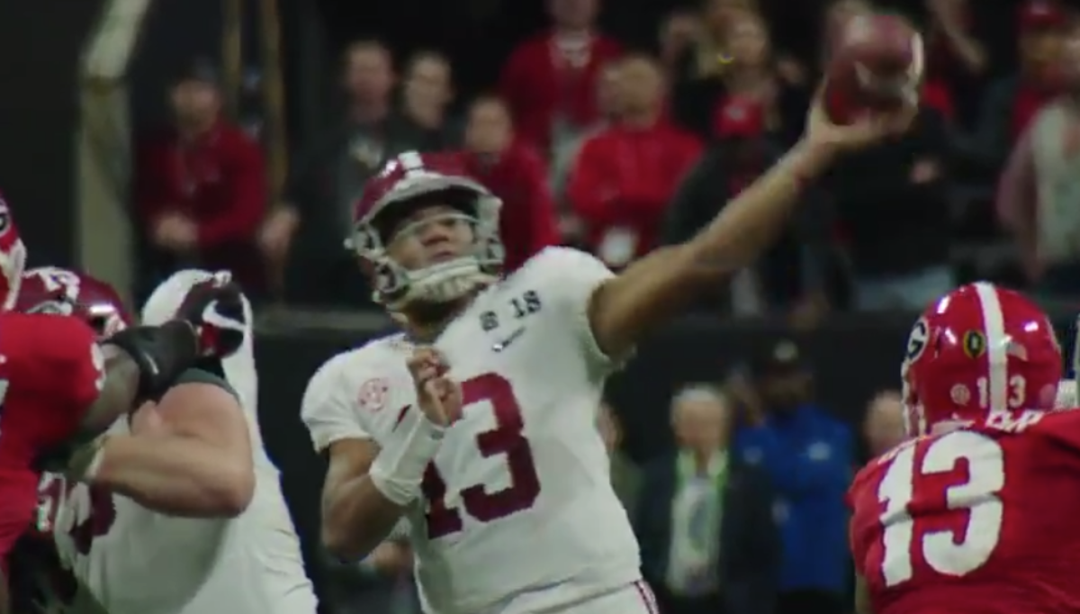 Tua Tagovailoa throws a pass in the national championship game.
