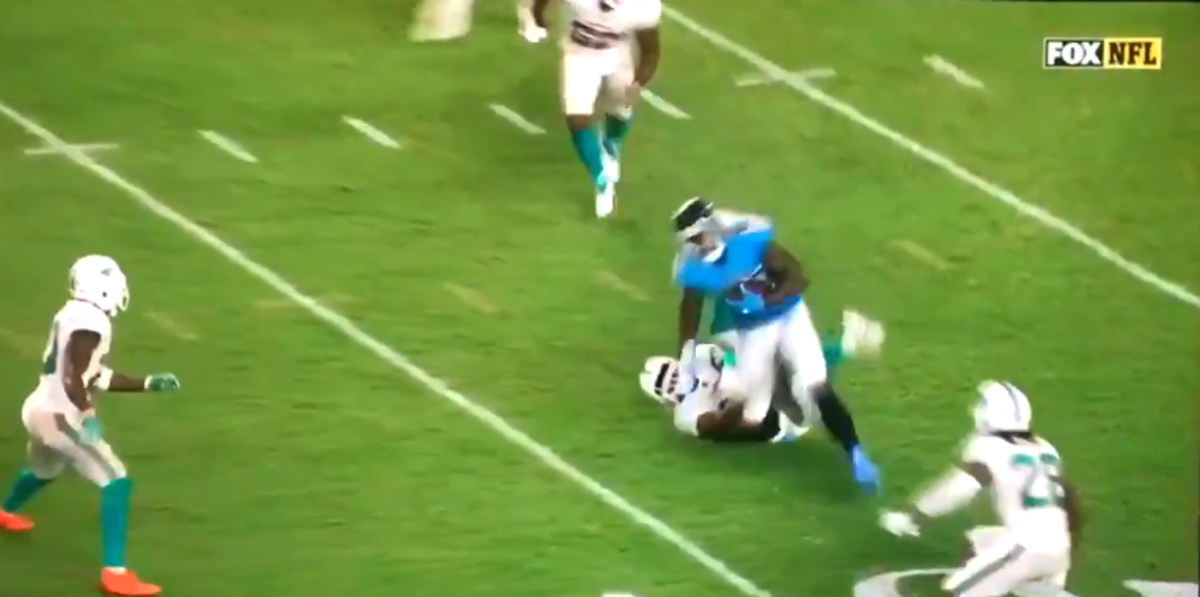 Delanie Walker gets tackled by the Miami Dolphins.