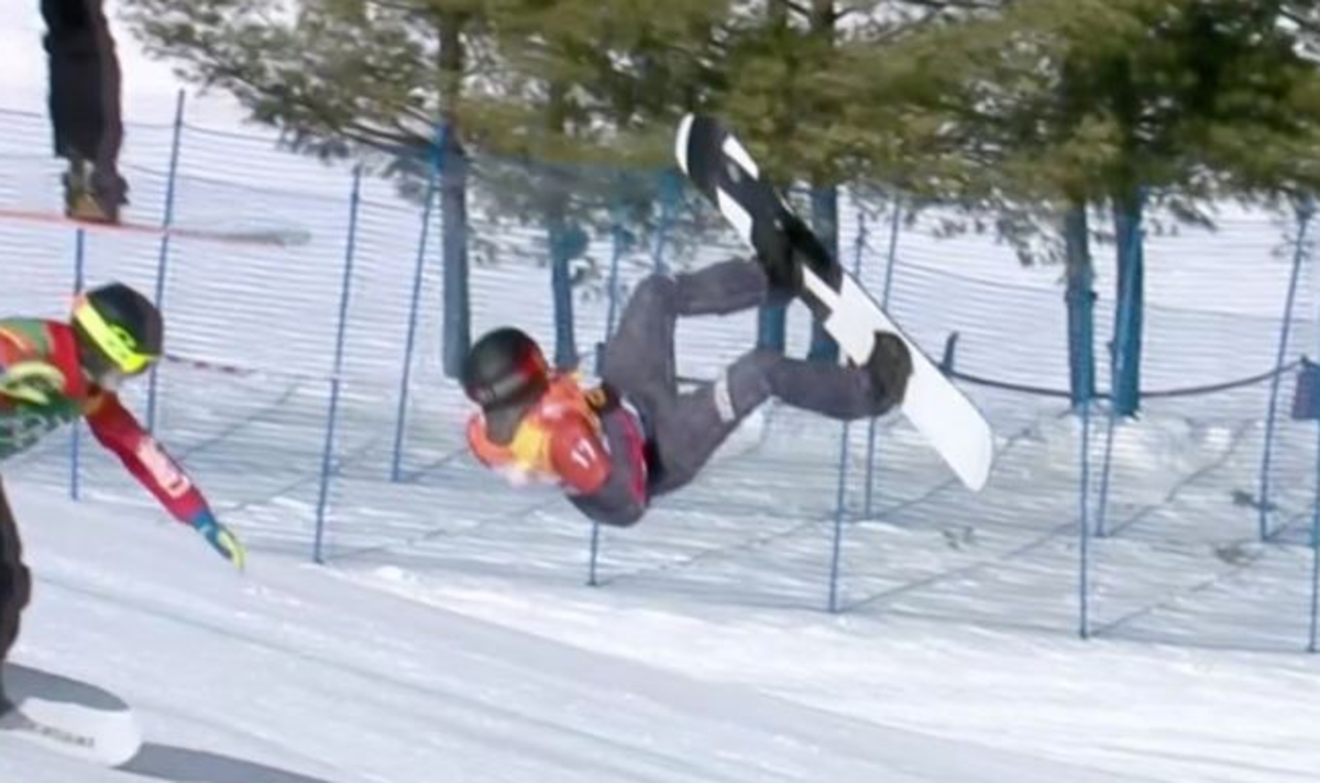 A snowboarder about to crash.