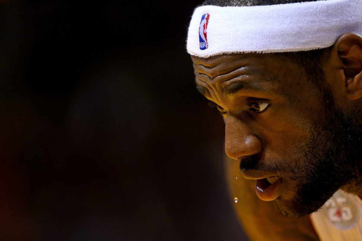 LeBron James sweating in a headband.