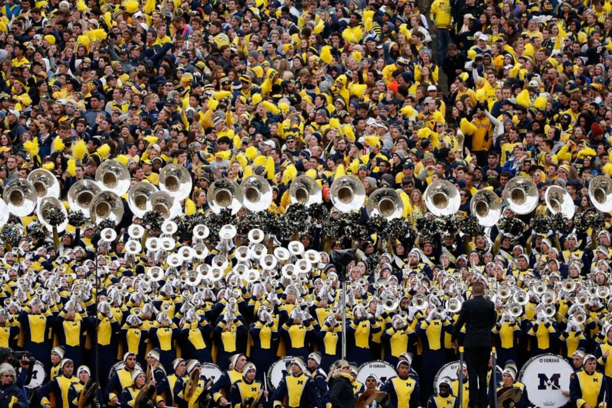 The Michigan Wolverines student section and marching band during the college football game against the Michigan State Spartans.