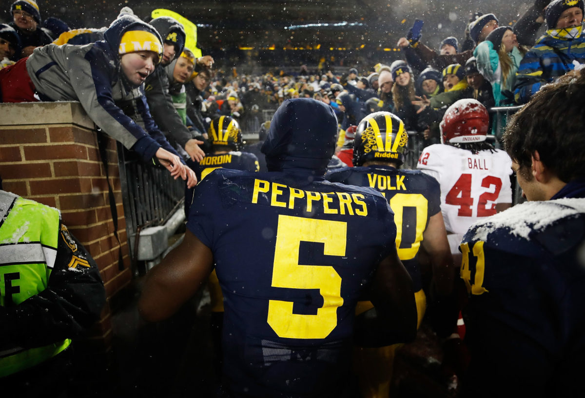 Jabrill Peppers of the Michigan Wolverines leaves the field after a 20-10 win over the Indiana Hoosiers.