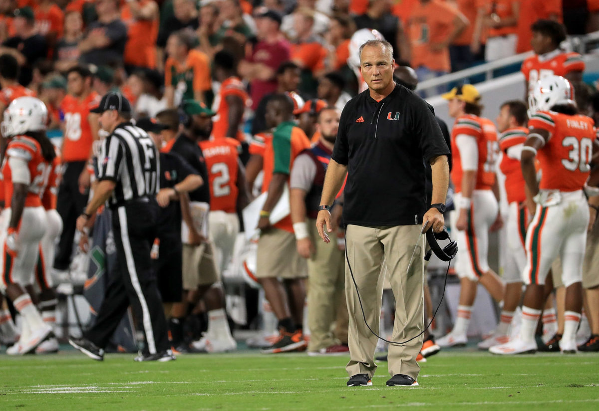 Mark Richt stares directly into the camera during a game.