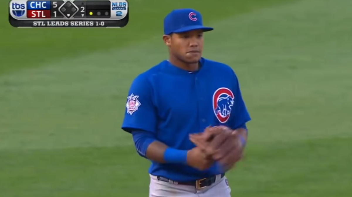 Addison Russell chews gum during a baseball game.
