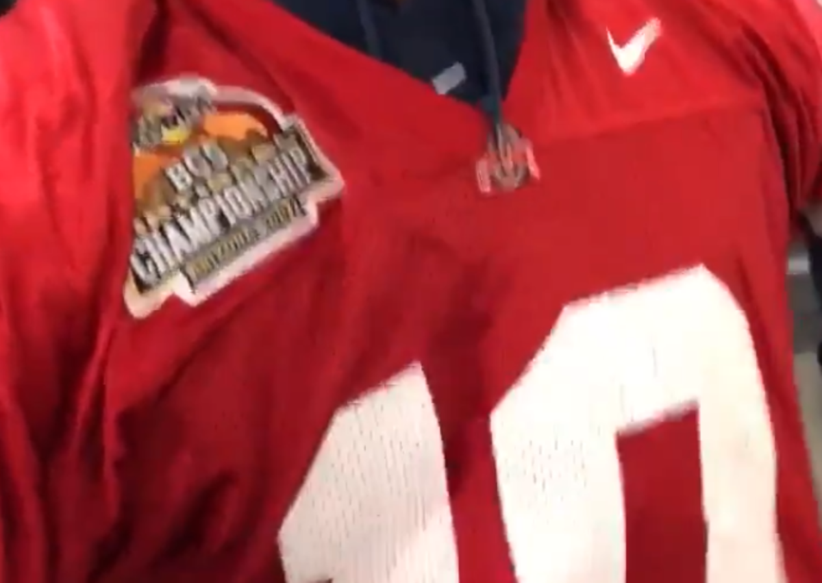Russell Wilson wears Troy Smith Ohio State jersey to pay off bet.