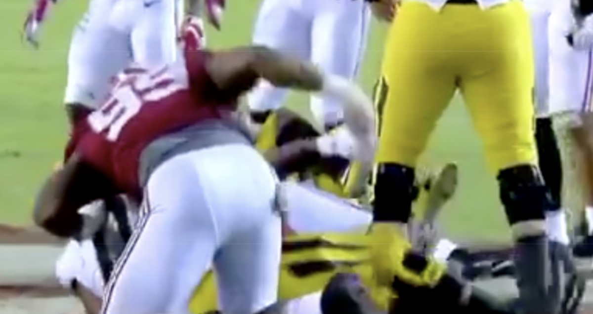 alabama player caught punching an opponent