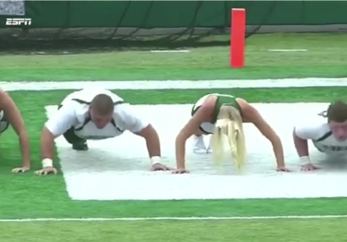 Ohio cheerleader attempts push-ups.