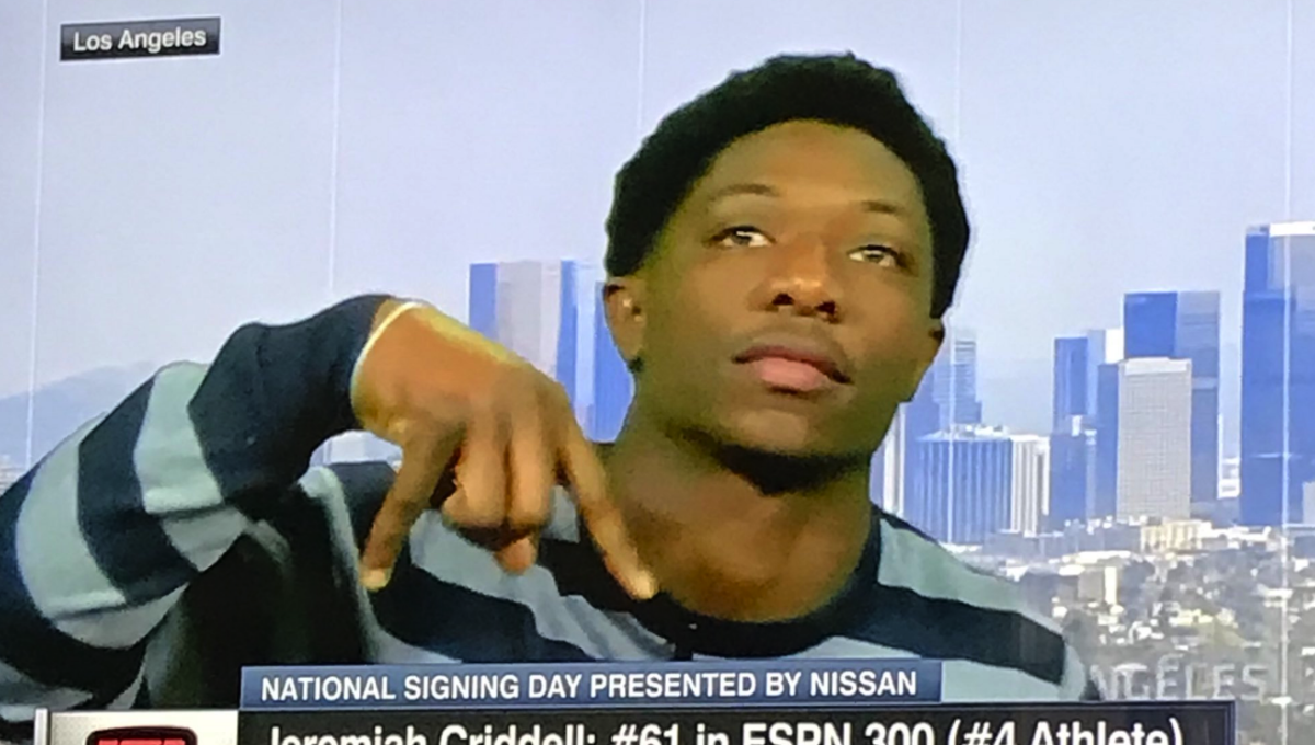 Oklahoma commit Jeremiah Criddell does horns down.