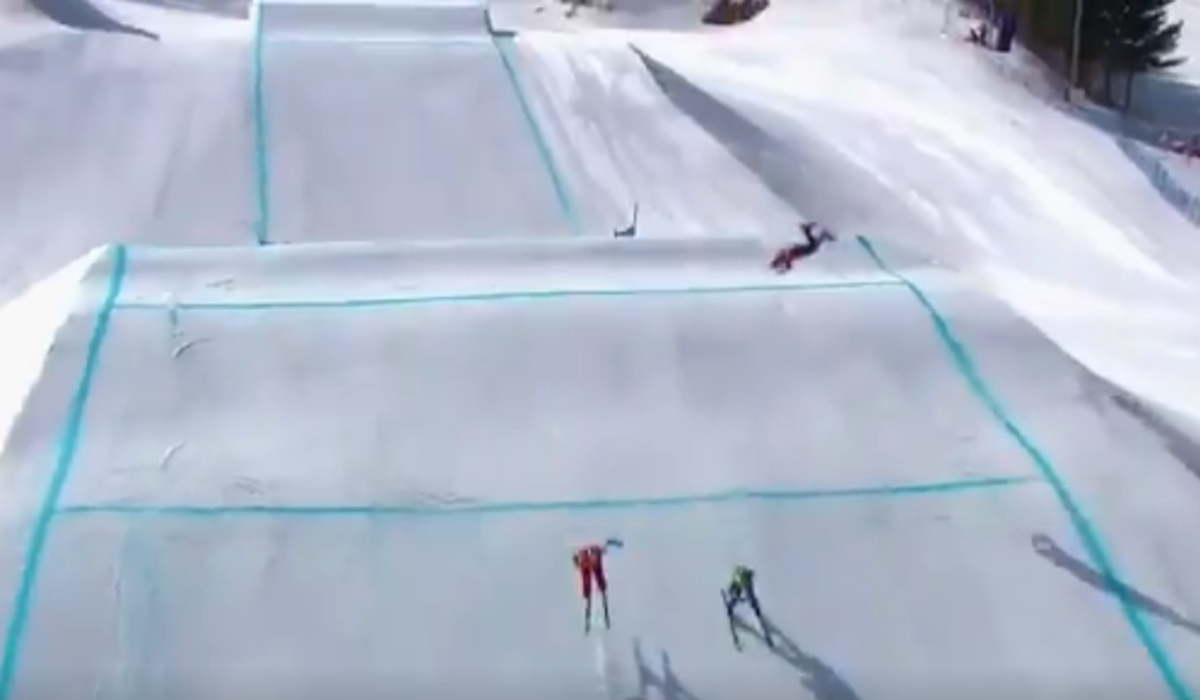 A skier crashes in the Olympics.